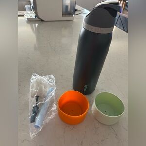 Owala Black Water Bottle with Accessories the color is Foggy Tide